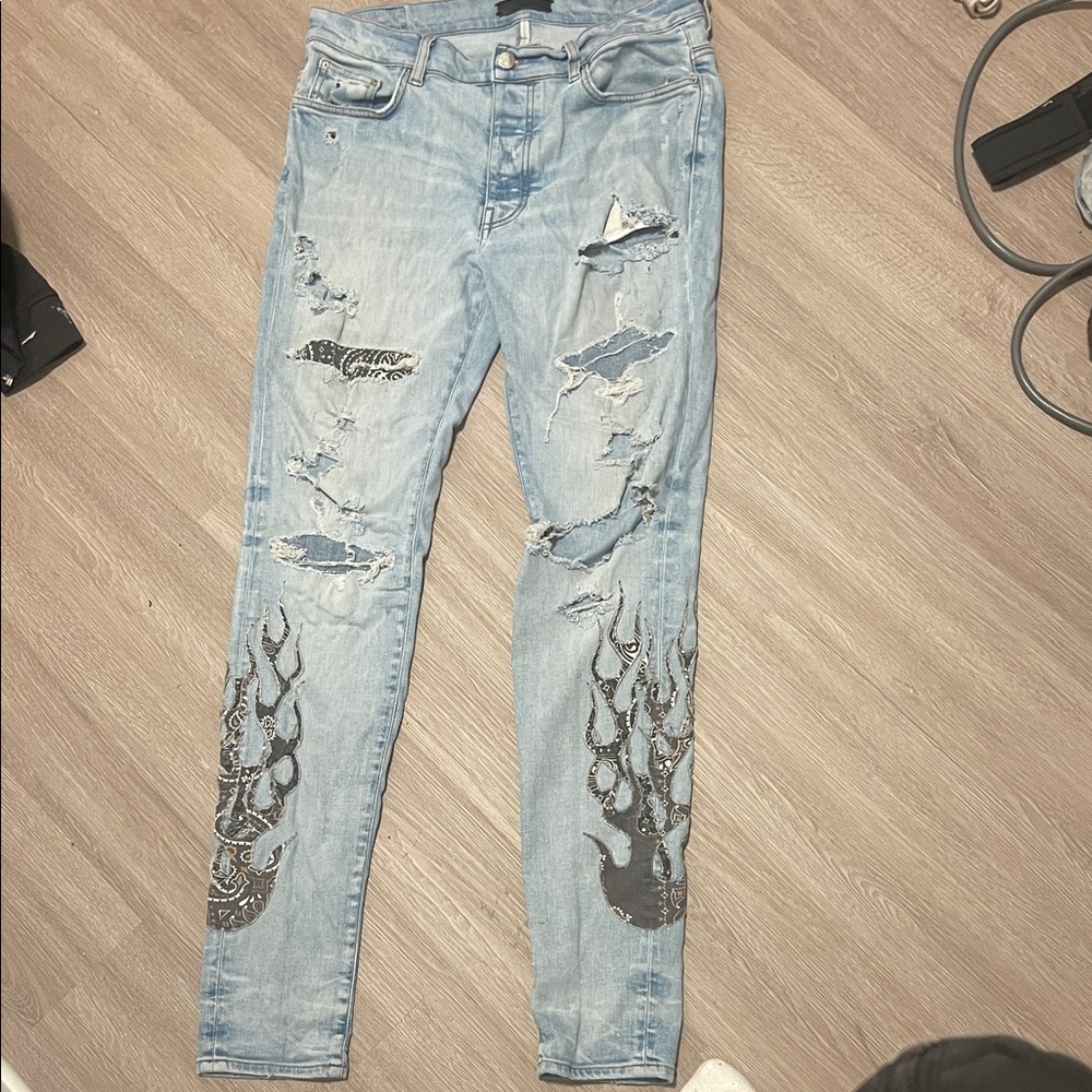 AMIRI Light Blue Jeans with Black Flame Accents